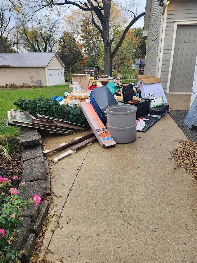 Dumpster being loaded with debris for 3 Yard Dumpster Rental in Decatur